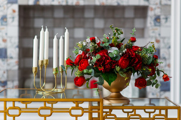 Decor of red roses and candles.