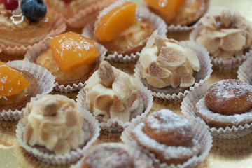 tasty beautiful little cakes for tea or coffee in a cafe or shop