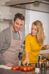 couple at home having fun cooking together