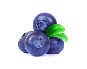 Blueberries with green leaves closeup on white background