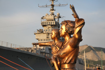 Fototapeta na wymiar Sculpture of wife of sailor at Lazar Serebryakov embankment in Novorossiysk. Krasnodar region. Russia