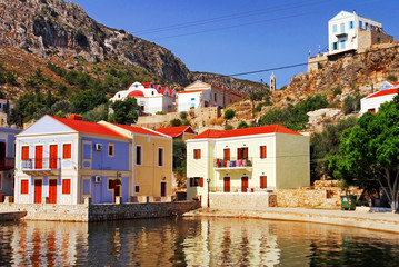 Fototapeta na wymiar Traditional houses by the harbour of the town of Kastelorizo, Kastelorizo island, Dodecanese islands, Greece