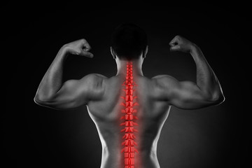 Pain in the spine, a man with backache, injury in the human back