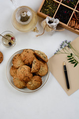 Still life with tea cup and cookie on white background. Top view.