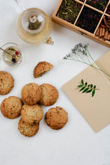 Still life with tea cup and cookie on white background. Top view.