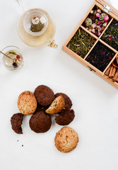 Still life with tea cup and cookie on white background. Top view.