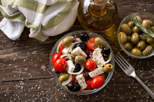 Mediterranean salad with feta cheese and Greek olives top view .