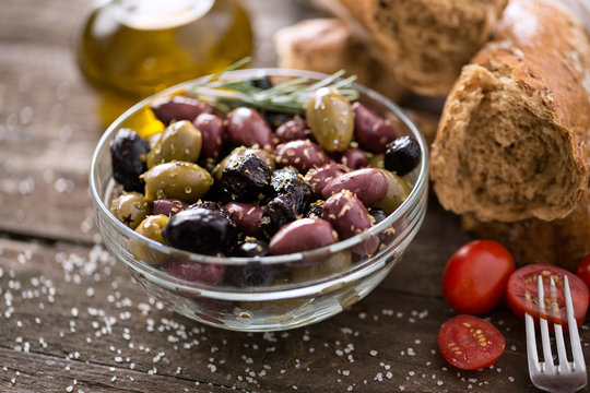 Mediterranean mix of olives for salad in oil .