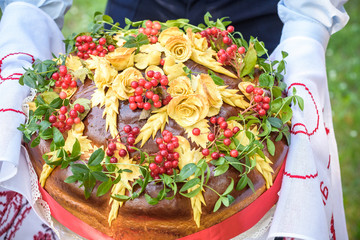 Traditional wedding Ukrainian bread Korovai with flowers