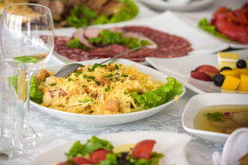 catering table set service with silverware and glass stemware at restaurant before party