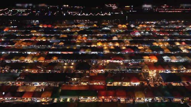 Neon market in city at night, time lapse