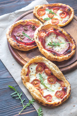 Mini pizzas on the wooden board