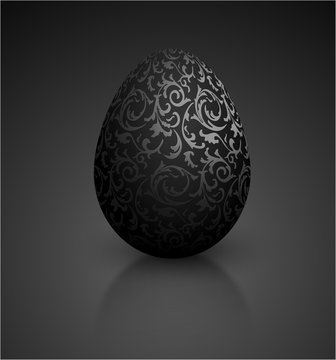 Black color mat realistic egg with metallic floral pattern. Isolated on black background with reflection. Vintage banner, card, poster for Easter, business benefit concept.
