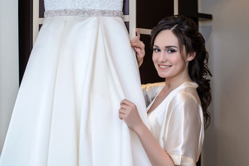 Beautiful bride beside in their different wedding dresses