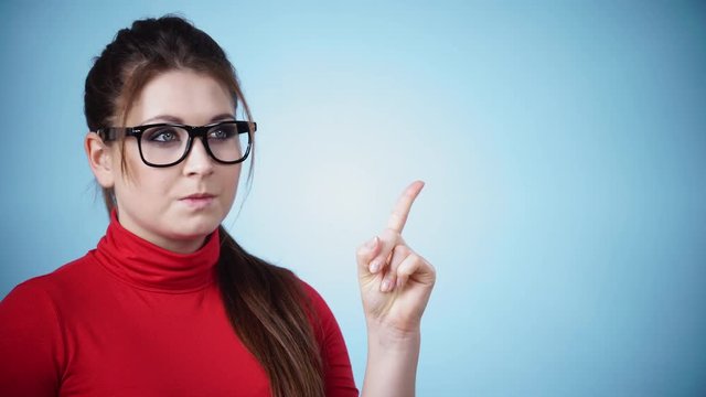 Young woman say no by shaking head, wagging her finger, rejecting gesture, disagree sign. Serious sad face expression. 4K ProRes HQ codec