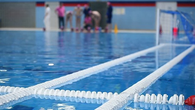 Olympic swimming pool lane dividers during water polo match