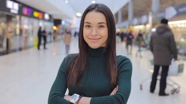 Pretty girl looking at camera and smiling