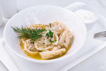 Dumplings with sour cream and herbs