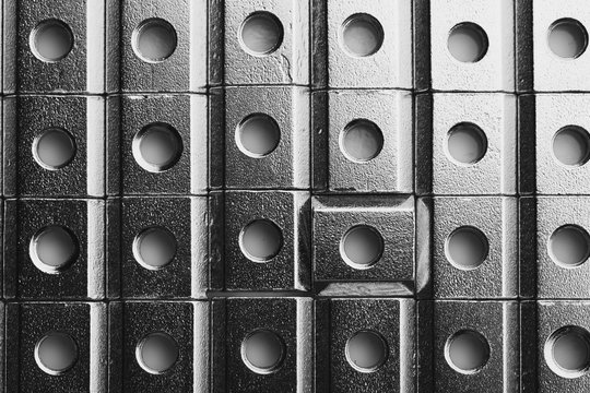 slide screw nuts in a row, abstract industrial background