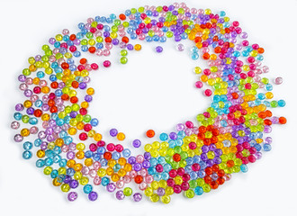 Background of colored beads on a white background
