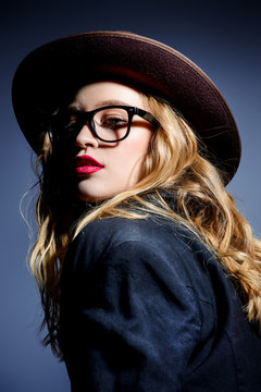 girl in hat and glasses