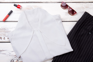 Female white blouse and black skirt. Set of business style apparel and accessories for women. Lookbook of female formal outfit.