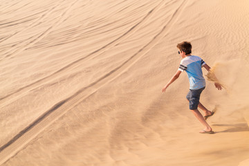 Teenage boy having fun at desert