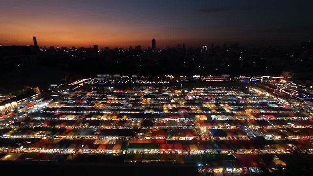 Neon market in city at night, time lapse