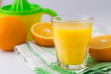 Fresh citrus fruit Juice on the white table Citrus press
