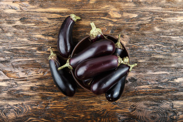 harvest of eggplant on a wooden table