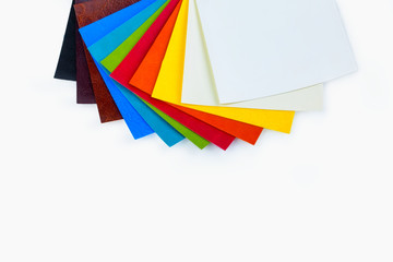 colored samples of fabric on the background. place for text. top view
