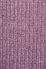 Knitted dark pink wool background.