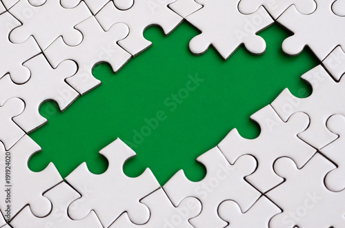 Close Up Texture Of A White Jigsaw Puzzle Inembled State With Missing Elements Forming Close Up Texture Of A White Jigsaw Puzzle Inembled State With Missing Elements Forming
