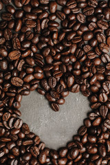 roasted coffee beans, can be used as a background. The concept of Valentine's day. Heart of coffee beans