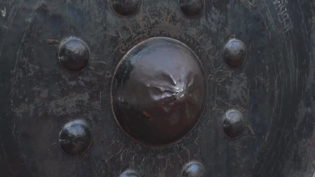 Hitting the oriental gong, Thailand, slow motion.