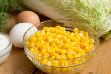 Healthy salad corn, cabbage.Eggs boiled on vegetable salad.