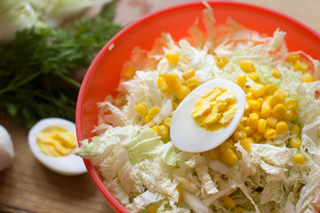 Healthy salad corn, cabbage.Eggs boiled on vegetable salad.