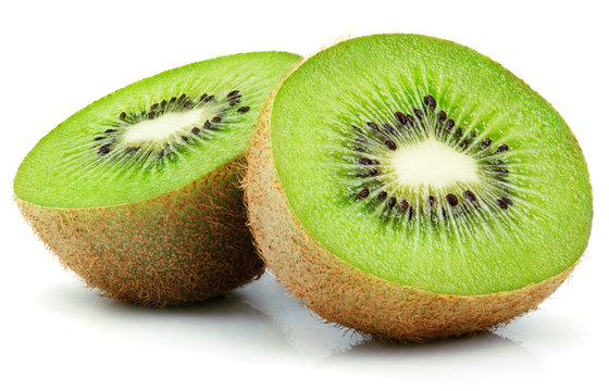 Two halves of ripe kiwi fruit isolated on white background