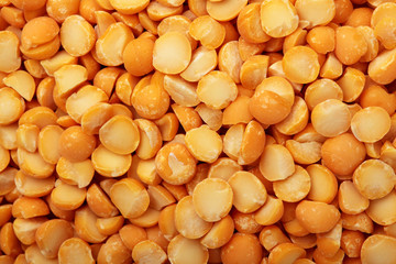Dried yellow pea split background texture top view.Selective focus.