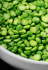 Dried green pea split background texture top view.Selective focus.