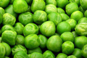 Fresh green peas background texture top view.Full depth focus.