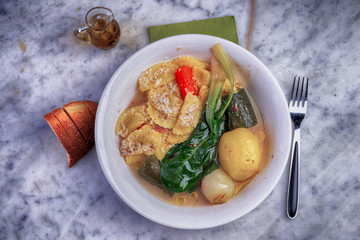 Delicious vegetable and vegetable soup with pasta agnolotti