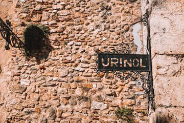 An old toilet sign in Lisbon, Portugal