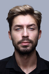 Obraz premium Close-up portrait of a young handsome man