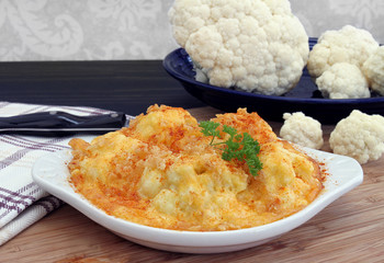 Baked Cauliflower in a creamy cheddar cheese sauce.