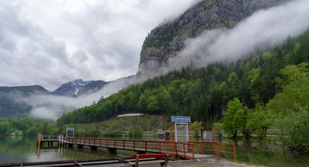 Small harbor port in Obertraun with mountain and low level cloud, Austria