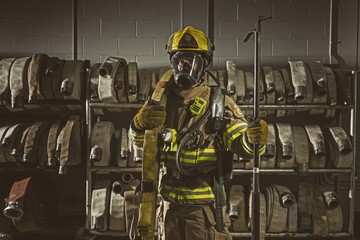 Firemen wearing his respiratory mask and protection gear