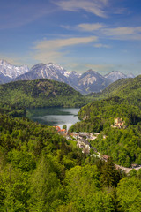 Obraz na płótnie Canvas hohenschwangau Castle with Alpsee lake in summer under clear blue sky