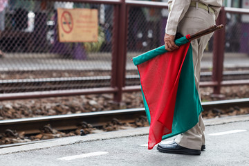 Officials with flags as a sign of safety