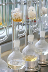 Soxhlet Extractor.Percolator-boiler and reflux,distillation flask on heating element.